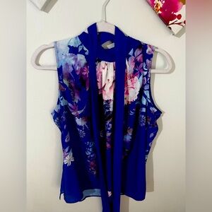 Floral Royal blue New York and Co. sleeveless top with attached fabric.